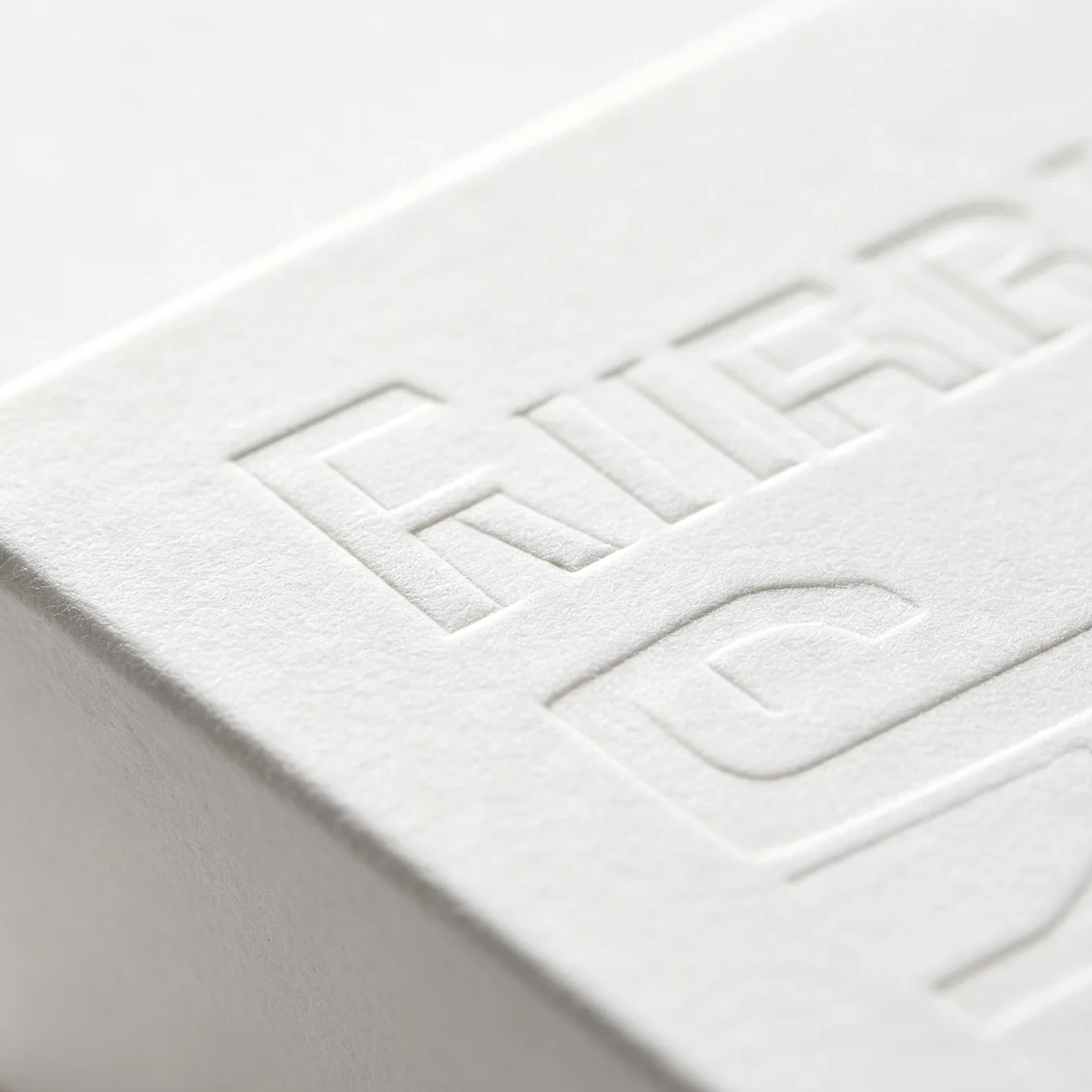 Embossing close-up raised texture relief packaging detail