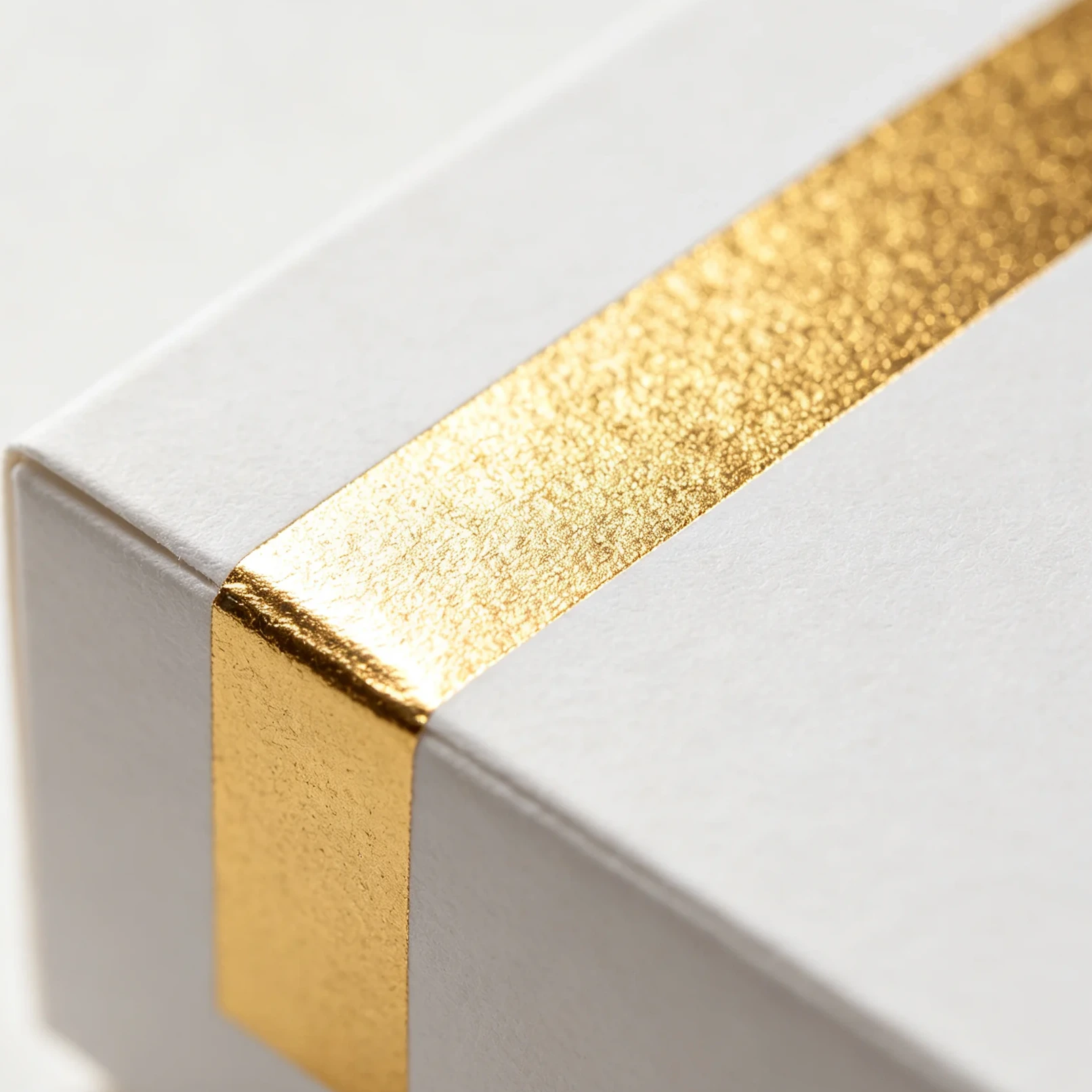Foil stamping close-up metallic texture gold foil packaging detail
